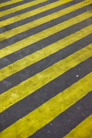 Diagonal yellow stripes on a street