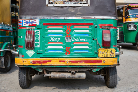 Close-up colorful hand-painted backside of a tuc-tuc in Rajasthan
