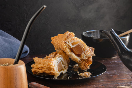 Argentinian pastelito cut in half where you can see the sweet potato candy inside.の写真素材