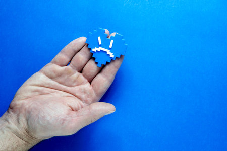 Blue Monday Concept. Hands of a man holding a blue heart.