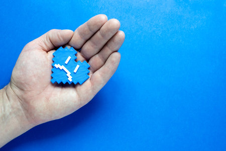 Blue Monday Concept. Hands of a man holding a blue heart.の写真素材