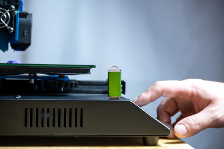 Hand touching screen of a 3d printer