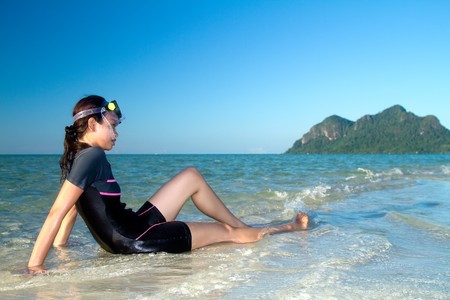Asian girl during holiday at beautiful islandの写真素材