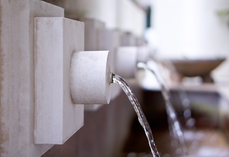 Man-made plaster wall fountain with shallow DOFの写真素材