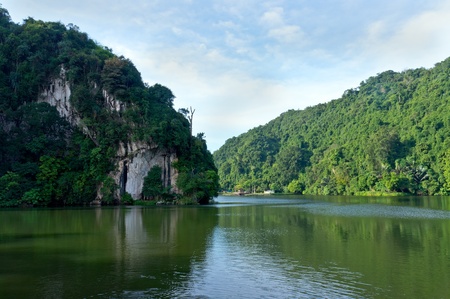 Tropical lake under blue cloudy sky