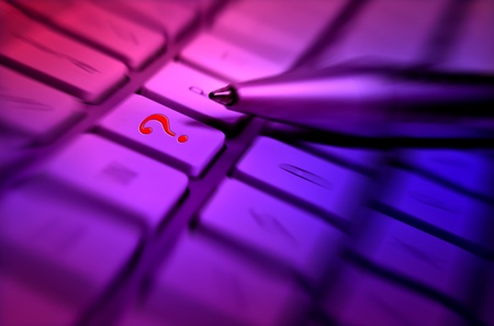 Question marks sign on keyboard - business and technology concept