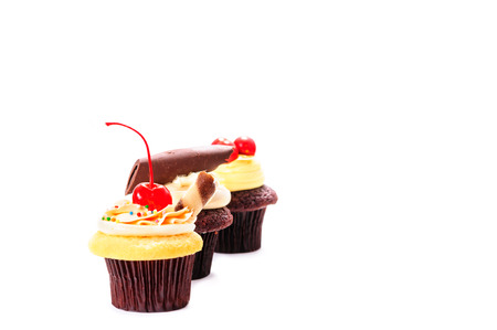 cherry chocolate cupcake on white backgroundの写真素材