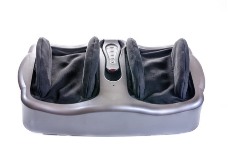 Electric vibrating feet massager on white backgroundの写真素材