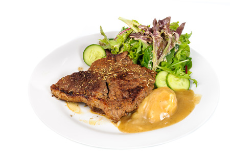 Rump steak with mashed potatoes and mix vegetable on plate isolated on white backgroundの写真素材
