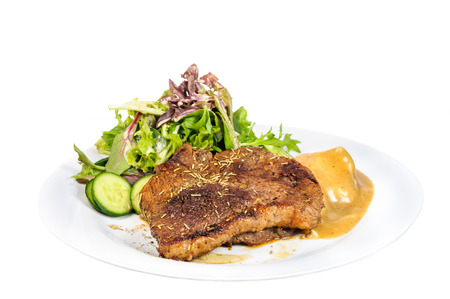 Rump steak with mashed potatoes and mix vegetable on plate isolated on white backgroundの写真素材