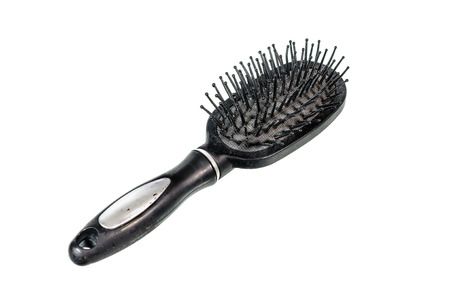 Old black comb isolated on white backgroundの写真素材