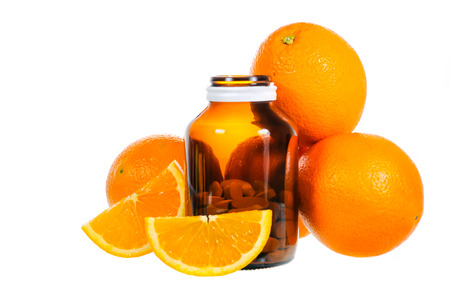 Ripe orange and vitamin c isolated on white backgroundの写真素材