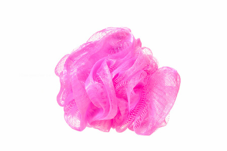Soft pink bath puff or sponge  isolated on white backgroundの写真素材