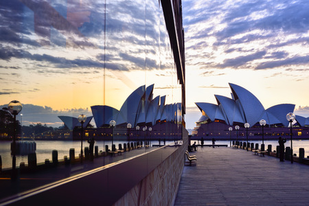 SYDNEY AUSTRALIA - August 22, 2015 : View of sunrise at Sydney Opera House in Sydney, Australia with reflection, Over 10 millions tourists visit Sydney every year,making Sydney one of the world's tourist destinationsのeditorial素材