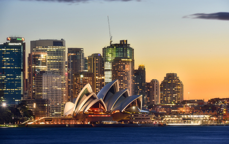 SYDNEY AUSTRALIA - August 21,2016: View Sydney CBD and The Opera House on sunset, Sydney, Australia, Over 10 millions tourists visit Sydney every yearのeditorial素材