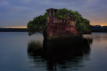 Sydney, Australia, The sunrise with shipwreck on the reef, Homebush Bay, Sydney, Australiaの写真素材