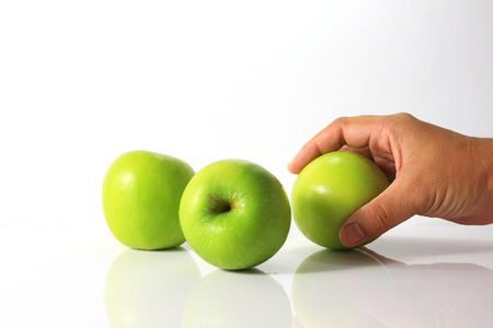 Take a green apple.の写真素材