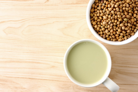 Soybean milk in white glass And soy beans in cupsの写真素材