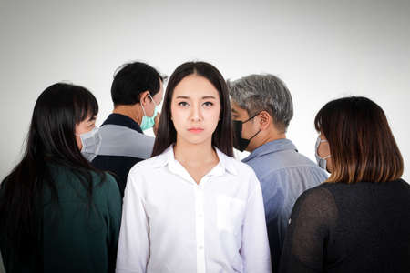 Asian women are scared of the people around them wearing antiviral masks. Covid-19 or coronavirus....