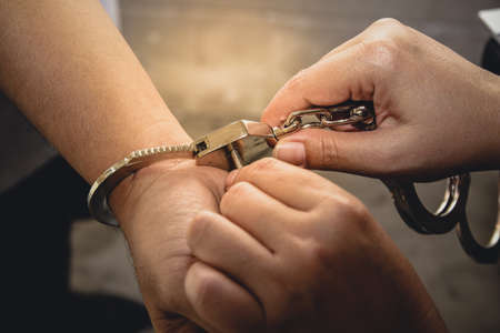 Man is handcuffed. The concept of theft prevention