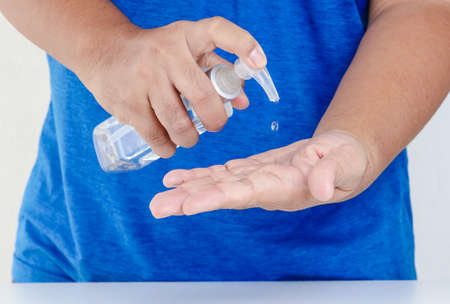 Washing hands with alcohol Put in the palm and rub all over the palm. Back of hands and fingers Until the alcohol evaporates until dry. Coronavirus prevention concept.の写真素材