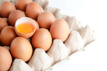 Many organic eggs are placed in the paper tray and there are egg yolks in the middle. Is a food that...