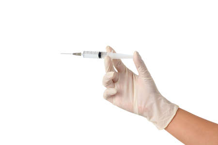 Doctors wear gloves Hold a vaccine needle to treat the patient. The concept of immunization. isolated.の写真素材