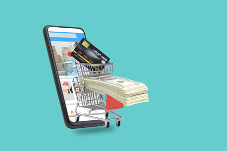 Cart put dollar funds and credit card mockup Is on the black smartphone screen. Online shopping concepts and financial technology through mobile screens.  background.の写真素材
