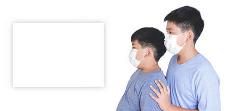Two Asian boys wear masks covering their mouth and nose, preventing coronavirus and dust. 2.5 pm. Children's health concepts. White background. copy space. clipping pathの写真素材
