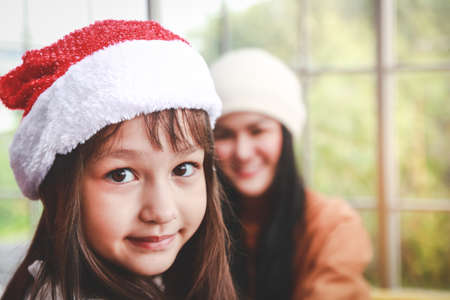 The girl smiled happily at Christmas. Holiday season. Happy New Yearの写真素材