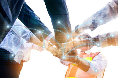 Businessmen and engineers, technicians work together as a team to develop real estate.の写真素材