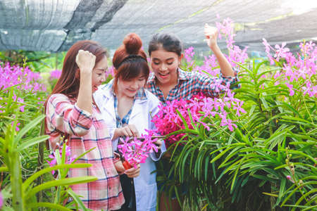 The owner of the orchid garden and plant researchers are glad. Quality through international standardsの写真素材