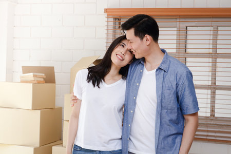 Asian couples move to their new home. Concept of starting a new life. Building a family. Copy spaceの写真素材