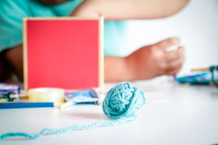 Children invent their own toys. There are many devices placed on a white table.の写真素材