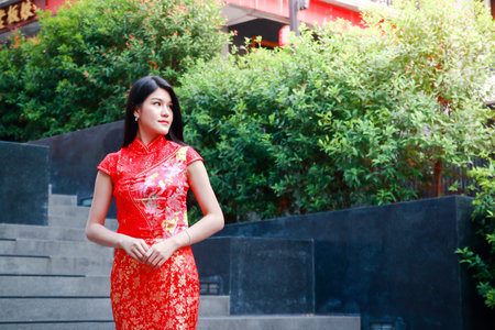 Asian white women wear cheongsam dresses to receive the New Year Chinese New Year Festival.の写真素材