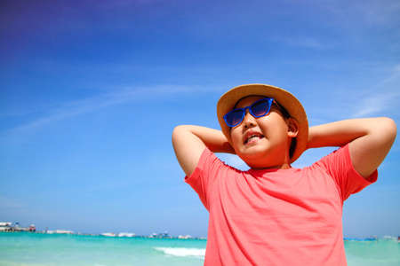 Boys wearing glasses Happy sea trip smiling. Travel conceptの写真素材