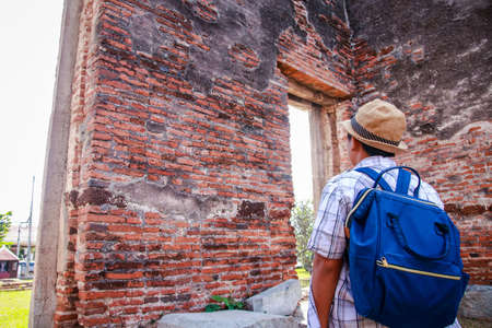 Children visit ancient historical sites in Thailand.の写真素材