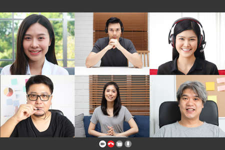 Webcam view on computer screen Various portraits are meeting online group video chat. Long distance communication concept During the coronavirus spread. Work from homeの写真素材