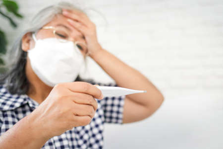 Asian elderly woman Stay at home to prevent infection.の写真素材