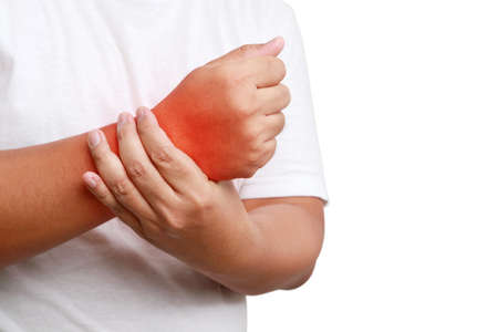 fat man wearing white shirt He has wrist pain, swelling and stiffness. Obesity concept and musculoskeletal disease. Arthritis is caused by joint deterioration, injury, inflammation, or infection.の写真素材