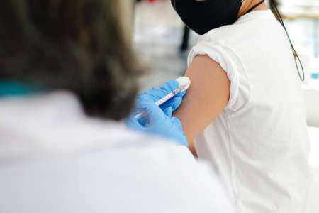 Doctors vaccinate boys to protect . Concept of medical services. prophylactic vaccine