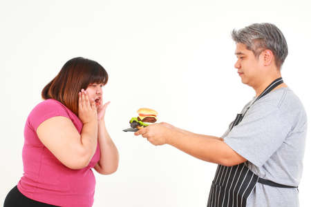 Asian couple makes hamburgers. food choice concept For good health for the body. Weight loss. Control your weight.の写真素材