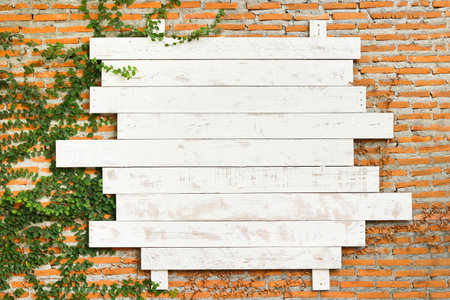 brick wall background image Place a light wood sign on the wall. Empty space for writing messages. Copy spaceの写真素材