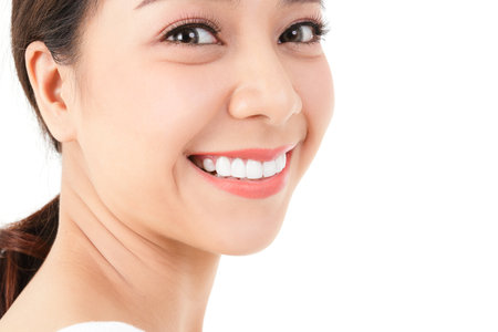 Beauty concept. beautiful asian woman have beautiful, clean teeth Bright, healthy skin. white background.の写真素材