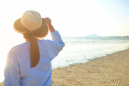 Asian elderly woman Smile, happy to come to the sea. Retirement tourism. Health insurance. Elderly society in retirement age. copy spaceの写真素材