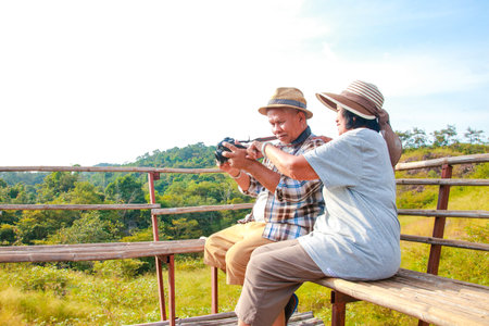 Asian elderly couple Happy to travel. Tourism concept of the elderly in retirement age. Tourists and travelers trekkingの写真素材