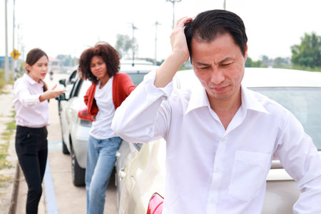 Stressed Asian man driving into car in front Put your hands on your stressed head. Transportation...