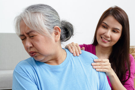 physical therapist Shoulder massage for the elderly with pain. Shoulder inflammation. chronic shoulder painの写真素材