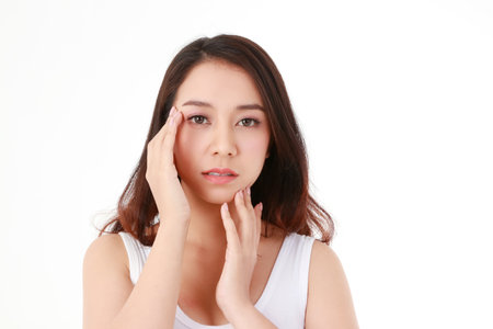 Portrait of a beautiful Asian woman with smooth and healthy skin. Beauty concept. white backgroundの写真素材