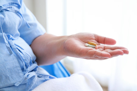 Fat female patient lying on a hospital bed In the hand holding the medicine. The concept of health insurance. disease of the obeseの写真素材